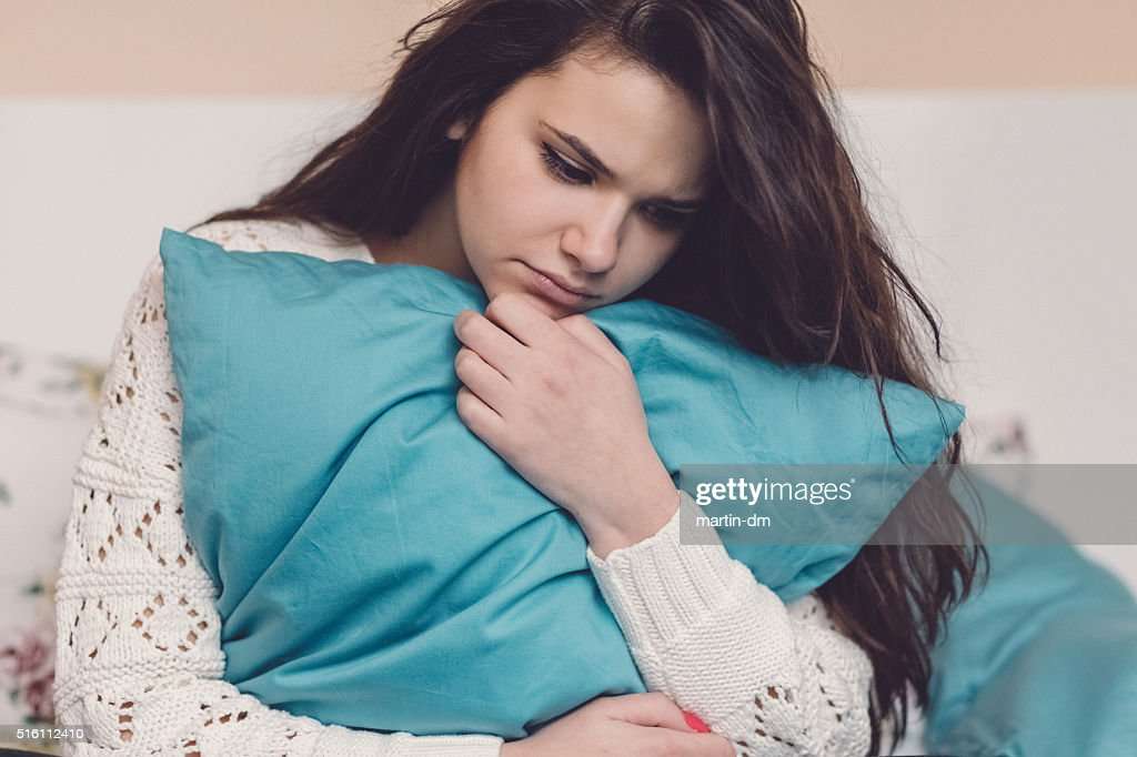 Depressed Teenage Girl In Bed High