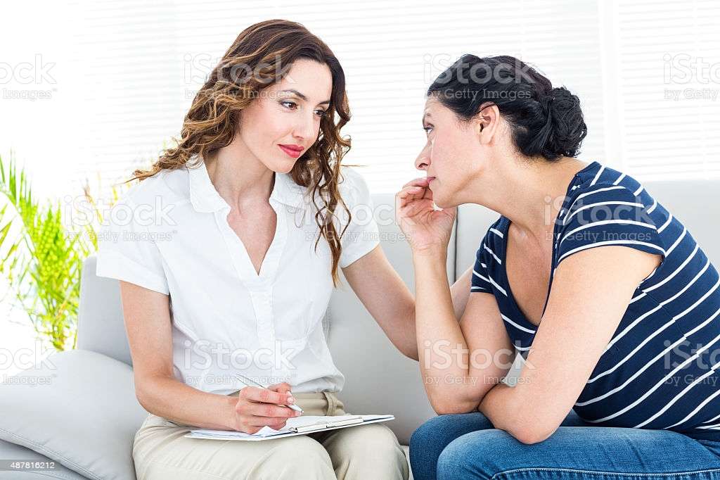 Depressed Woman Talking With Her Therapist Stock Photo ...