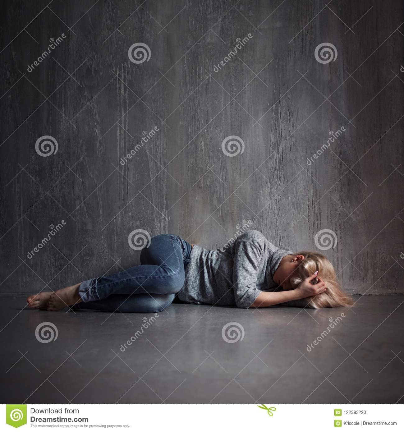 Depression. Young Woman Lying On The Floor Covering Head With Hands ...