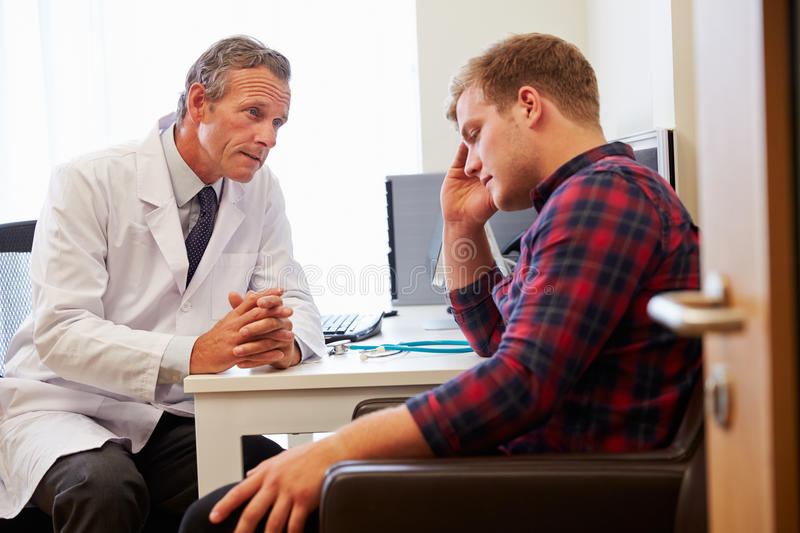 Doctor Treating Male Patient Suffering With Depression Stock Image ...