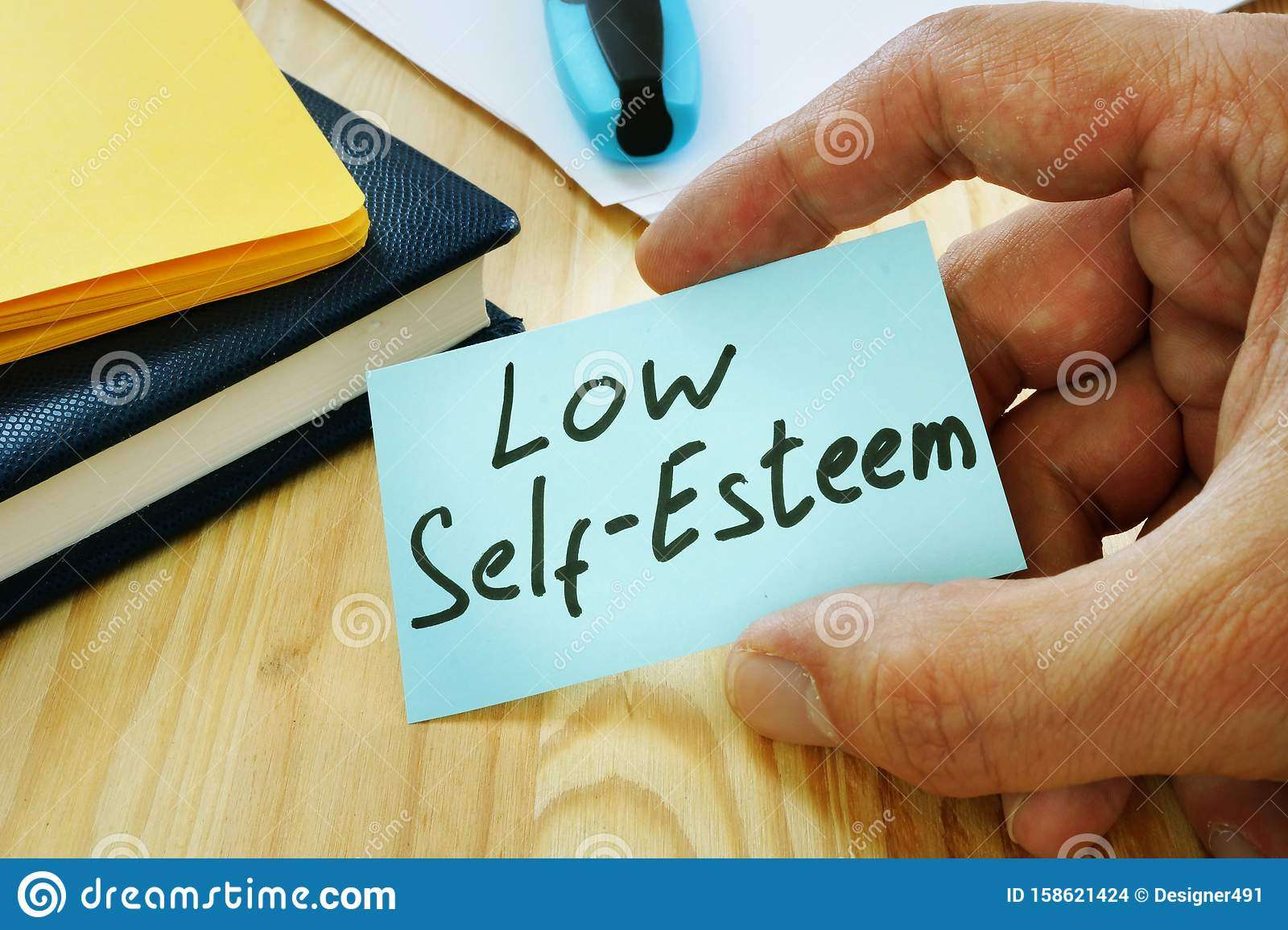 Low Self Esteem Sign In The Hand Stock Photo