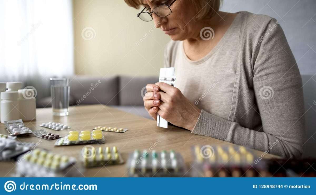 Unhealthy Elderly Female Depressed About Taking Too Much Medicine ...